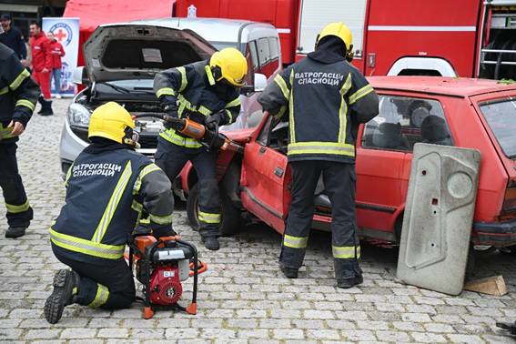 A group of firefighters working on a car

AI-generated content may be incorrect.